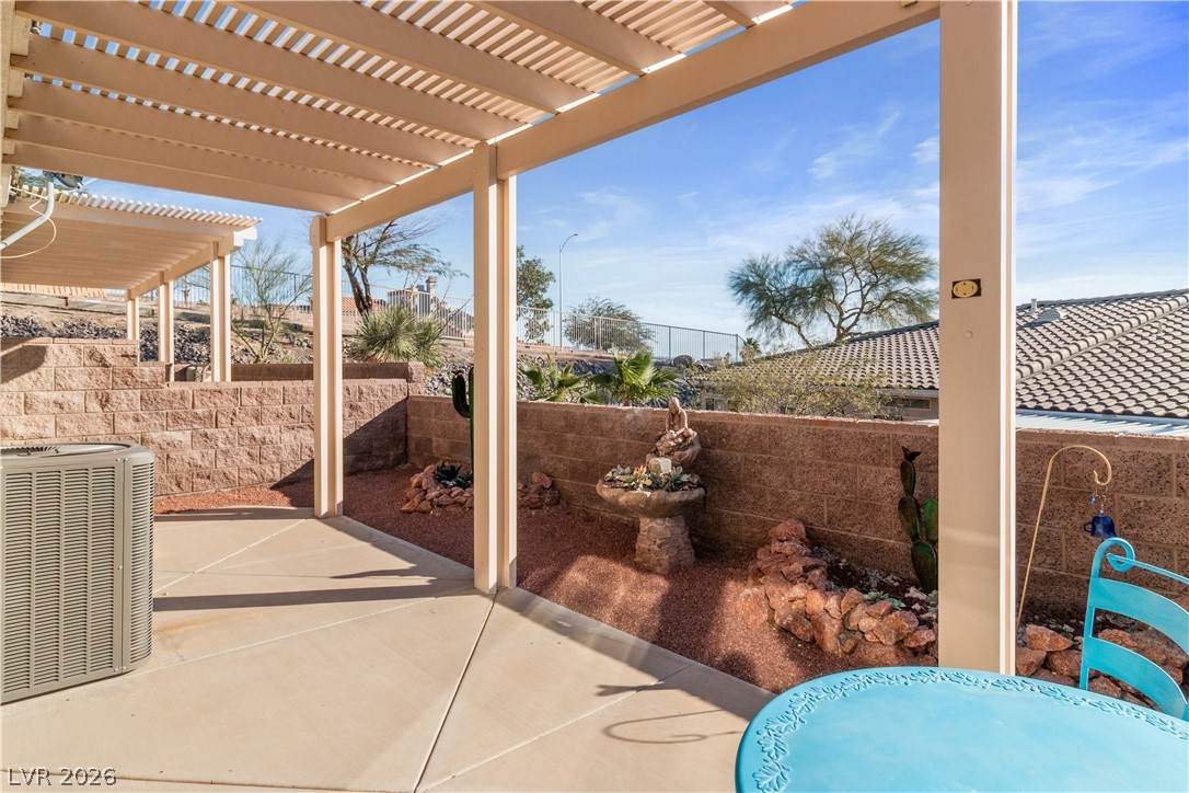3350 Pheasant Canyon Way, Unit 1008 Laughlin, NV 89029 - Photo 48 of 80 Fenced backyard featuring a patio area and a pergola