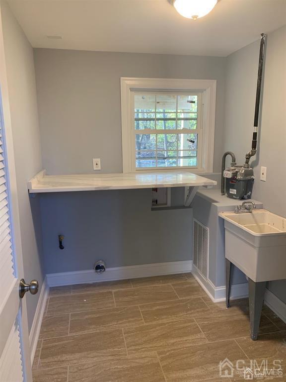179 Phillips Road Somerset, NJ 08873 - Photo 18 of 26 a bathroom with a sink and a mirror
