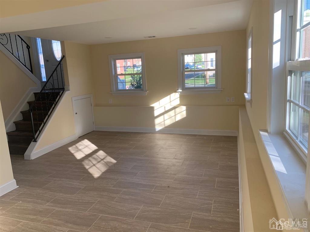 179 Phillips Road Somerset, NJ 08873 - Photo 19 of 26 a view of livingroom with hardwood floor and hallway