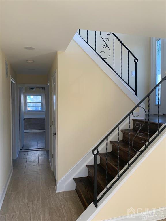 179 Phillips Road Somerset, NJ 08873 - Photo 21 of 26 a view of entryway and hall with wooden floor