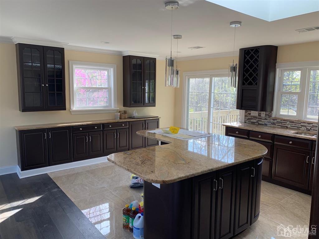 179 Phillips Road Somerset, NJ 08873 - Photo 26 of 26 a kitchen with granite countertop sink cabinets and refrigerator