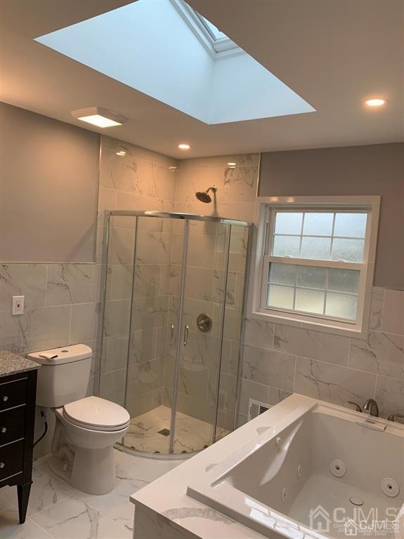 179 Phillips Road Somerset, NJ 08873 - Photo 5 of 26 a bathroom with a sink a toilet and shower