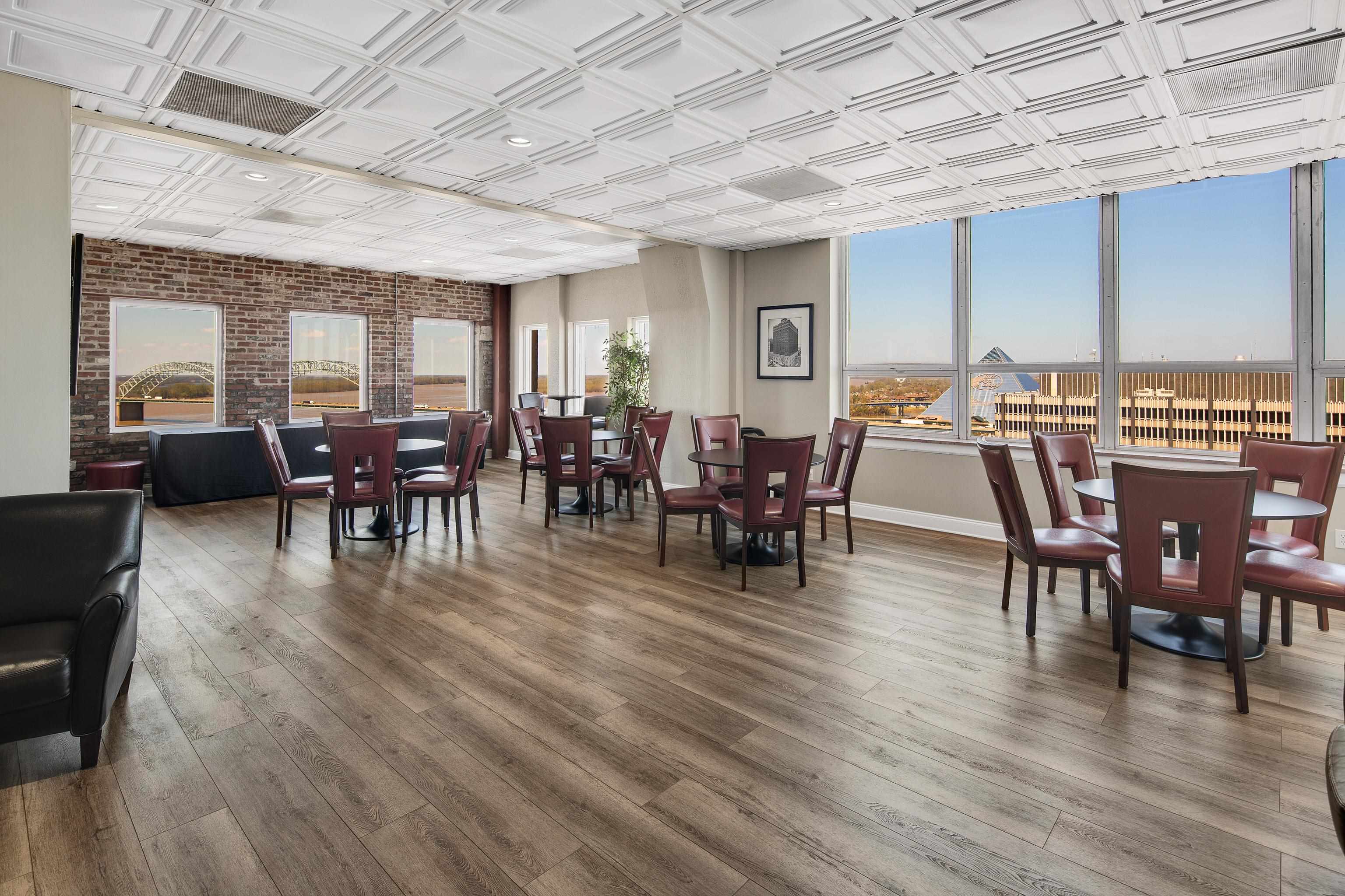 109 North Main Street, Unit 1610 Memphis, TN 38103 - Photo 15 of 35 a view of a dining room with furniture window and wooden floor