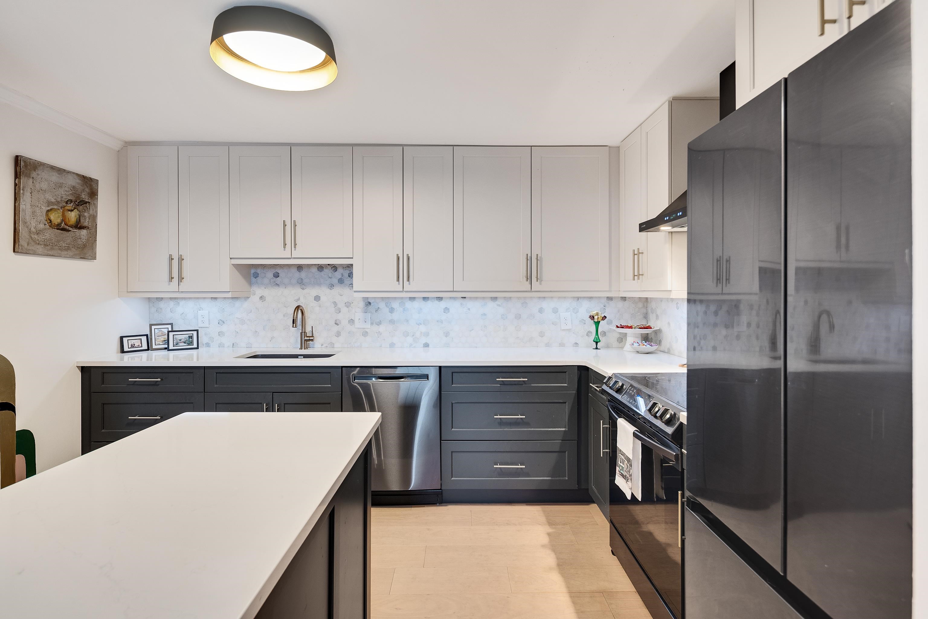 109 North Main Street, Unit 1610 Memphis, TN 38103 - Photo 22 of 35 a kitchen with stainless steel appliances granite countertop a stove a sink and a refrigerator