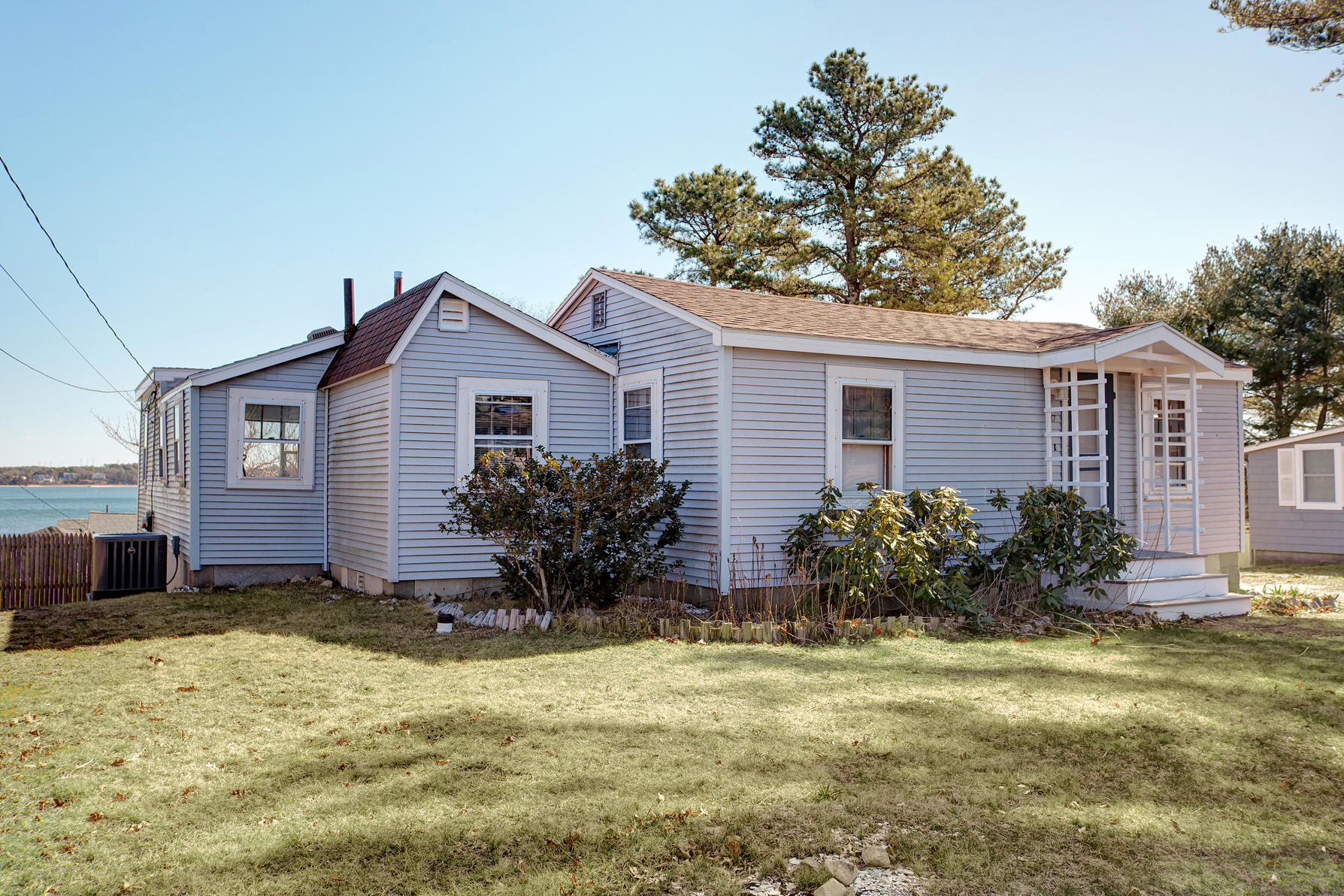 17 Hiawatha Road Buzzards Bay, MA 02532 - Photo 3 of 22 a front view of house with yard and trees around