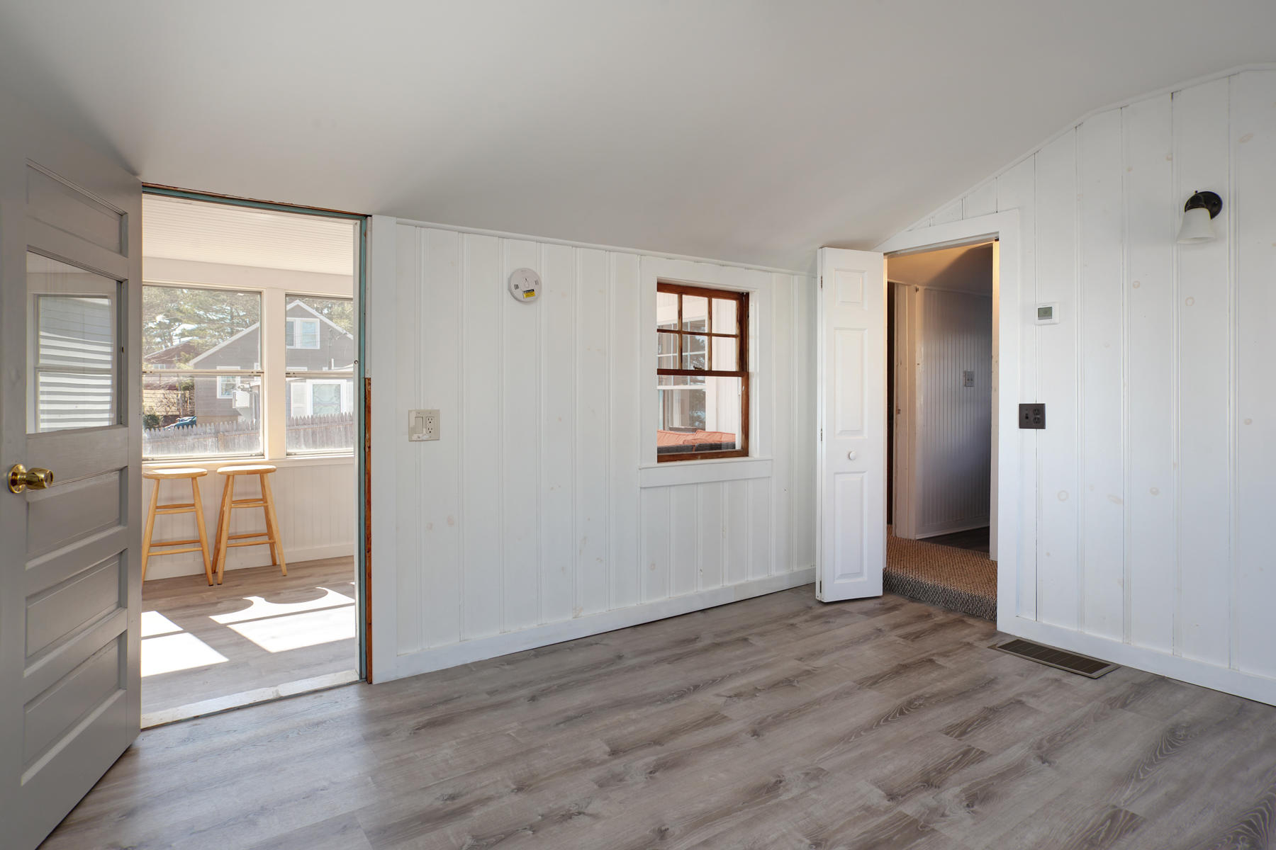 17 Hiawatha Road Buzzards Bay, MA 02532 - Photo 7 of 22 an empty room with wooden floor and windows