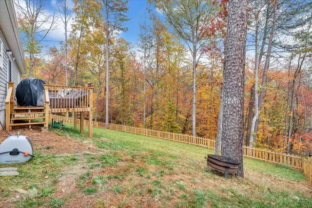 a view of a livingroom with furniture and a flat screen tv