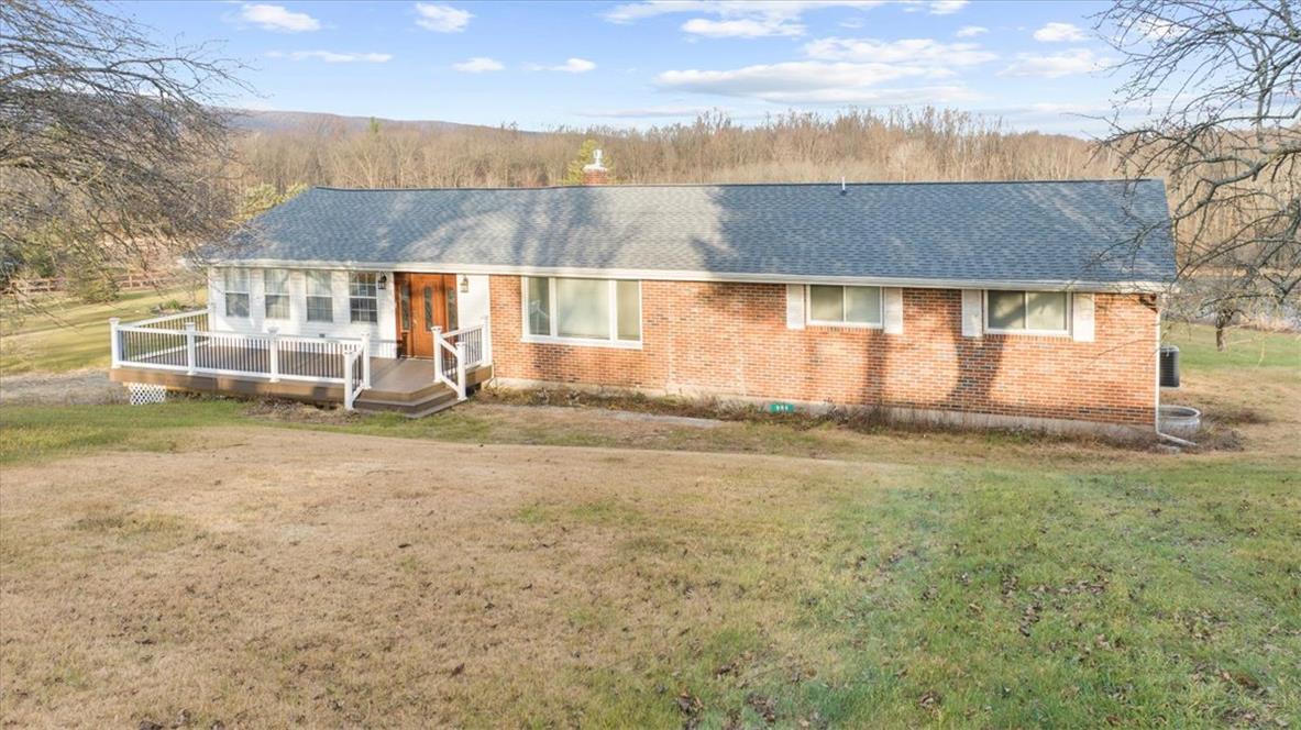 988 Hoch Road Danielsville, PA 18038 - Photo 1 of 29 A charming brick exterior with a welcoming deck and distant mountain vistas.