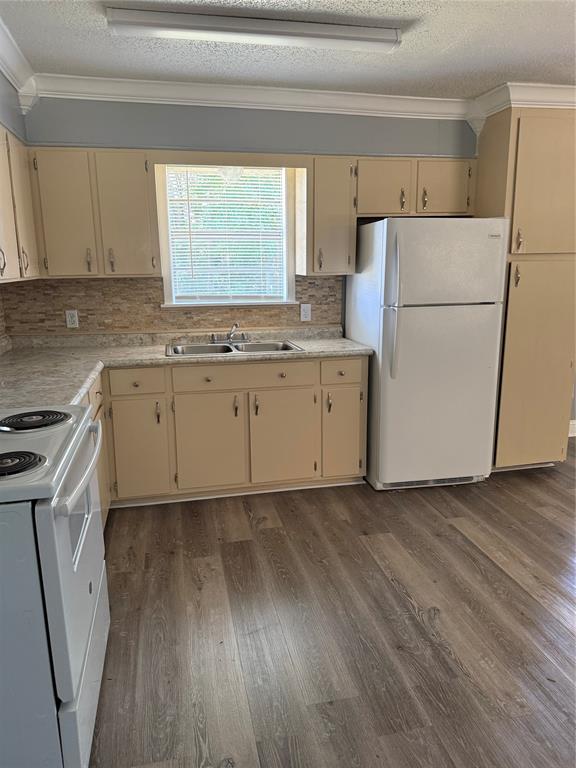294 FISHING GROUNDS Road Pelican, LA 71063 - Photo 12 of 22 a kitchen with a sink a refrigerator a washer and dryer