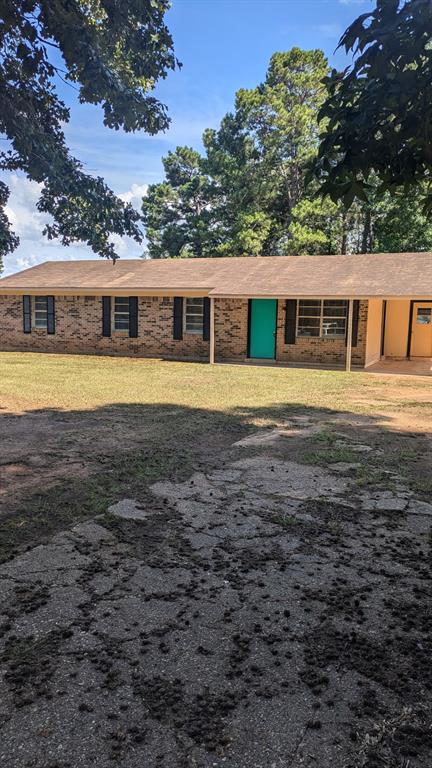 294 FISHING GROUNDS Road Pelican, LA 71063 - Photo 3 of 22 a front view of a house with a yard