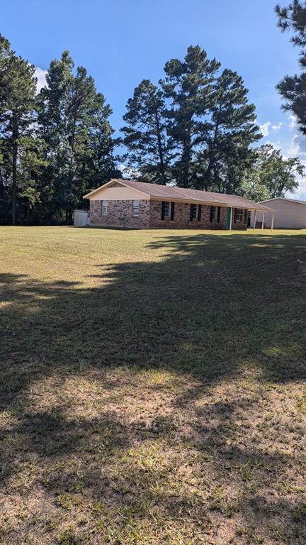 294 FISHING GROUNDS Road Pelican, LA 71063 - Photo 4 of 22 a view of a house with a yard