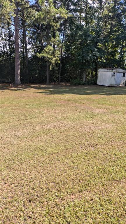 294 FISHING GROUNDS Road Pelican, LA 71063 - Photo 7 of 22 a view of a swimming pool with an outdoor space and seating area