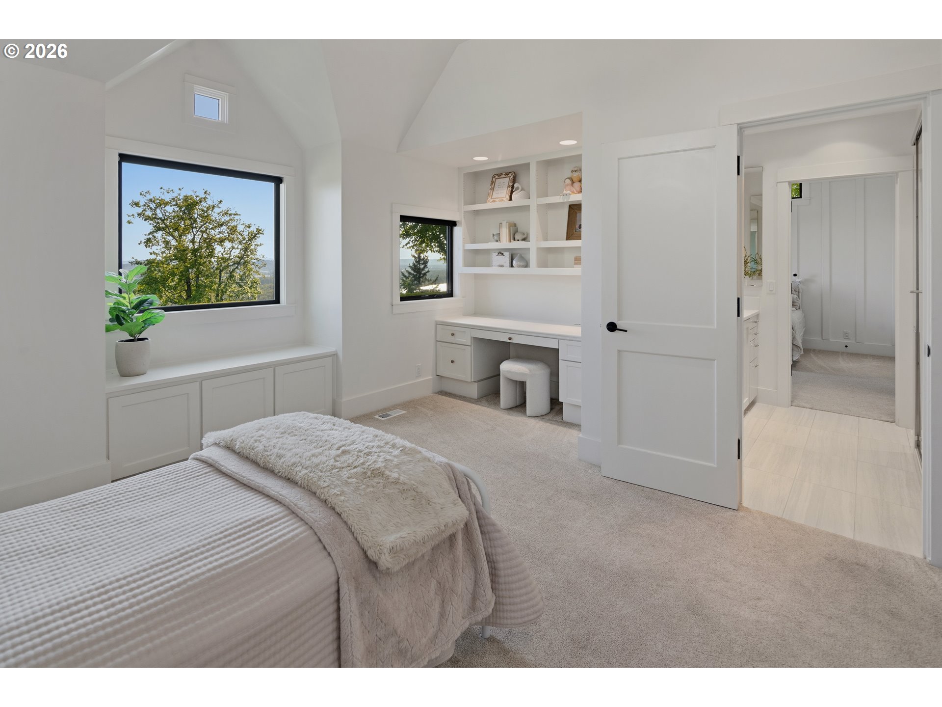 554 Northwest Dawson Ridge Drive Camas, WA 98607 - Photo 23 of 48 a bedroom with a bed and a painting on the wall