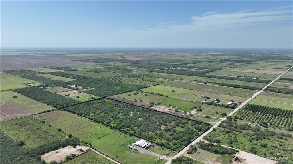 Aerial view of property and surrounding area with rural landscape and extensive farmland