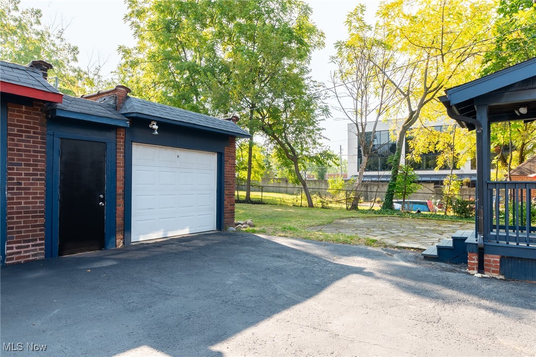 3459 Helen Road Shaker Heights, OH 44122 - Photo 26 of 29 Garage with fence and aphalt driveway
