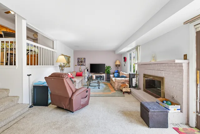 a bathroom with a granite countertop toilet sink and a mirror