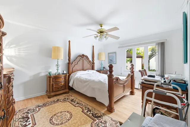 a bedroom with a bed and a table