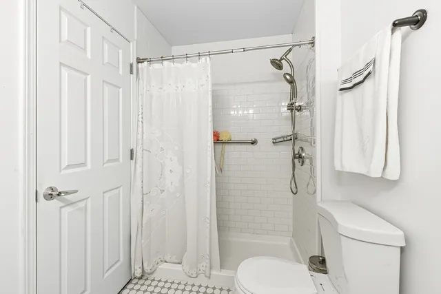 a front view of a house with lots of green space