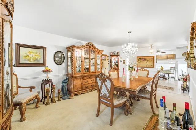 a kitchen with cabinets stainless steel appliances and a window