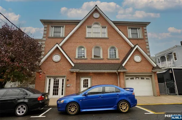 a car parked in front of a house