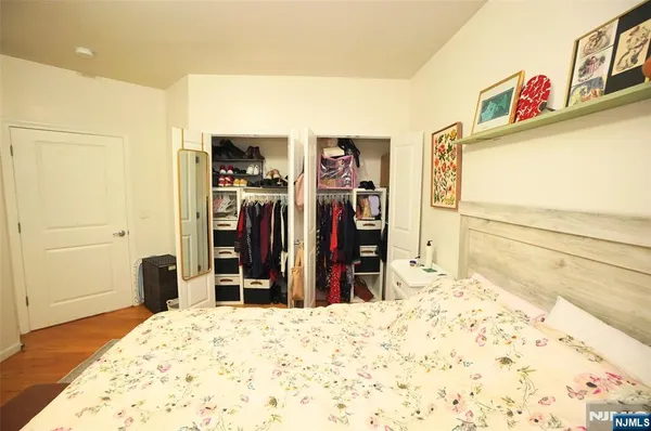 a view of a bedroom with a bed and closet