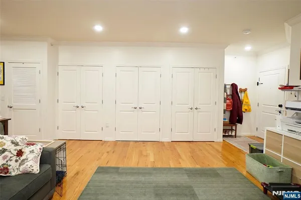 a view of a room with lots of furniture and clothes