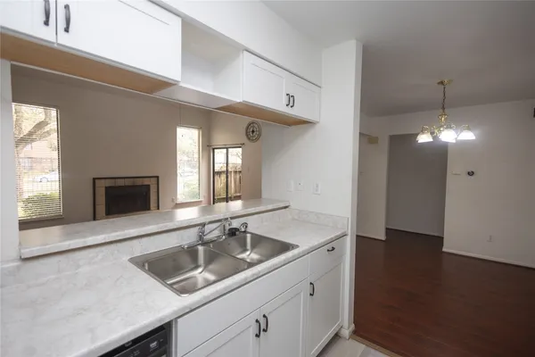 a bathroom with a sink and a large mirror
