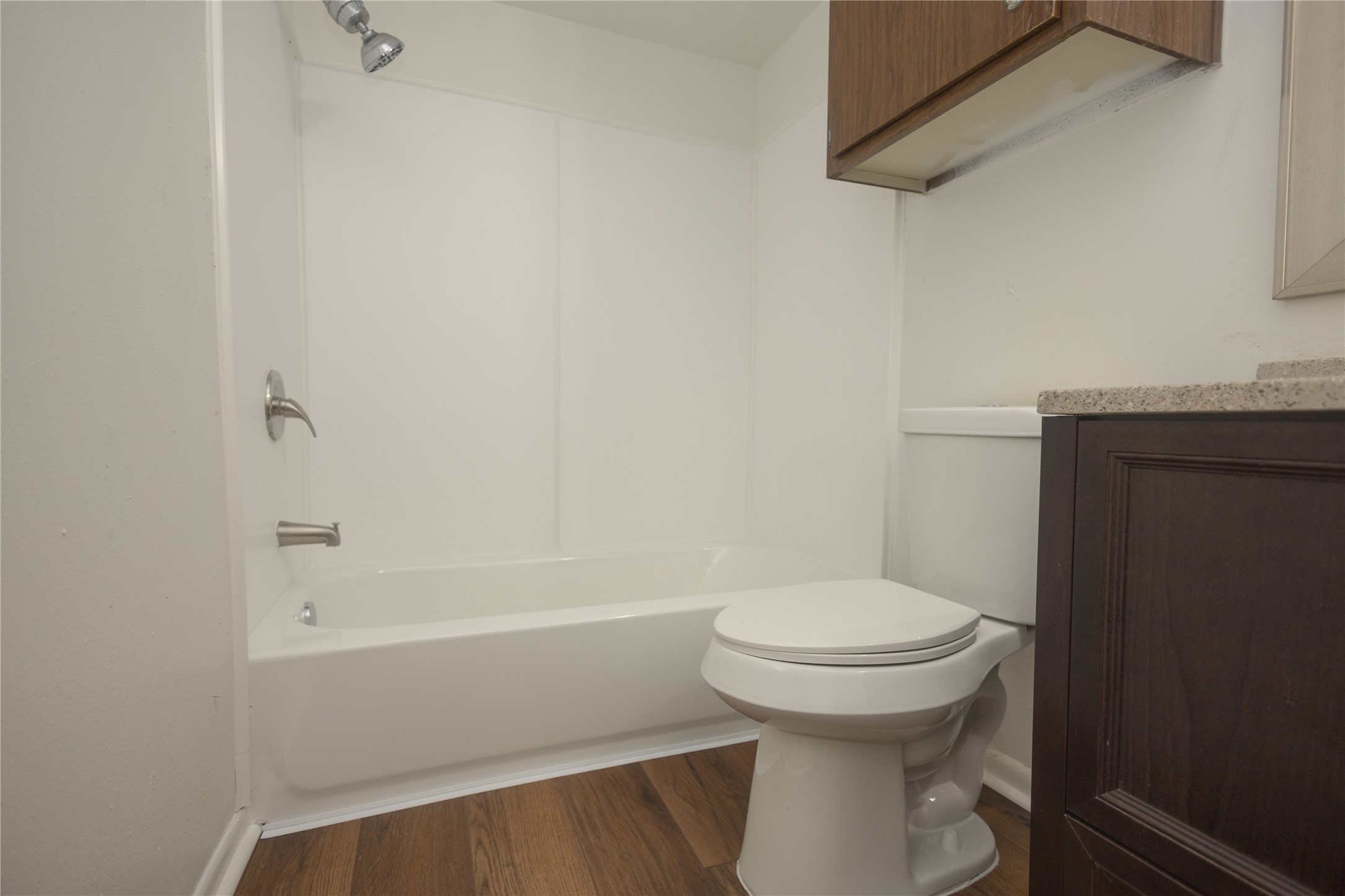 8100 Cambridge Street, Unit 89 Houston, TX 77054 - Photo 22 of 41 Alternate view of the downstairs secondary bathroom with a tub/shower combo and single-sink vanity.