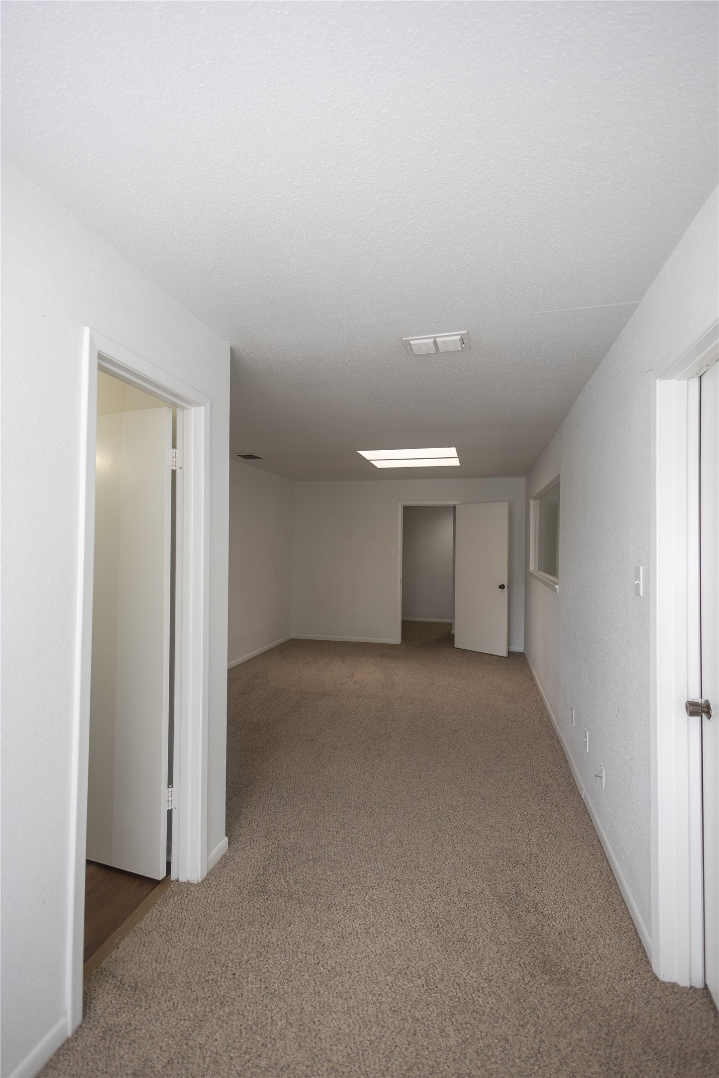 8100 Cambridge Street, Unit 89 Houston, TX 77054 - Photo 32 of 41 View of the primary bedroom from the desk/work area.