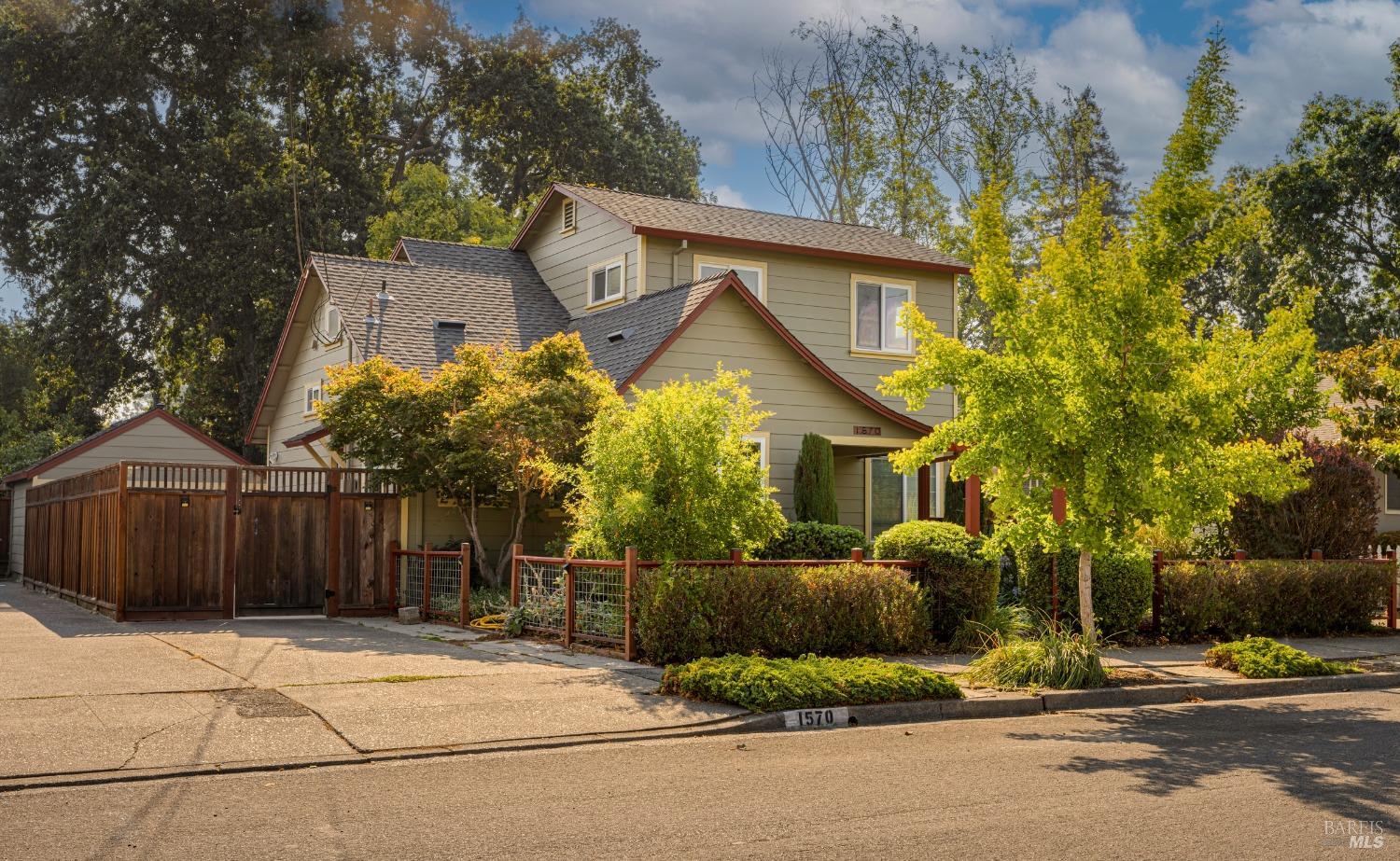 a view of a house with a yard and plants