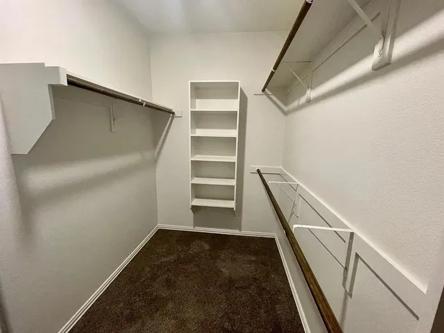 a view of an empty walk in closet