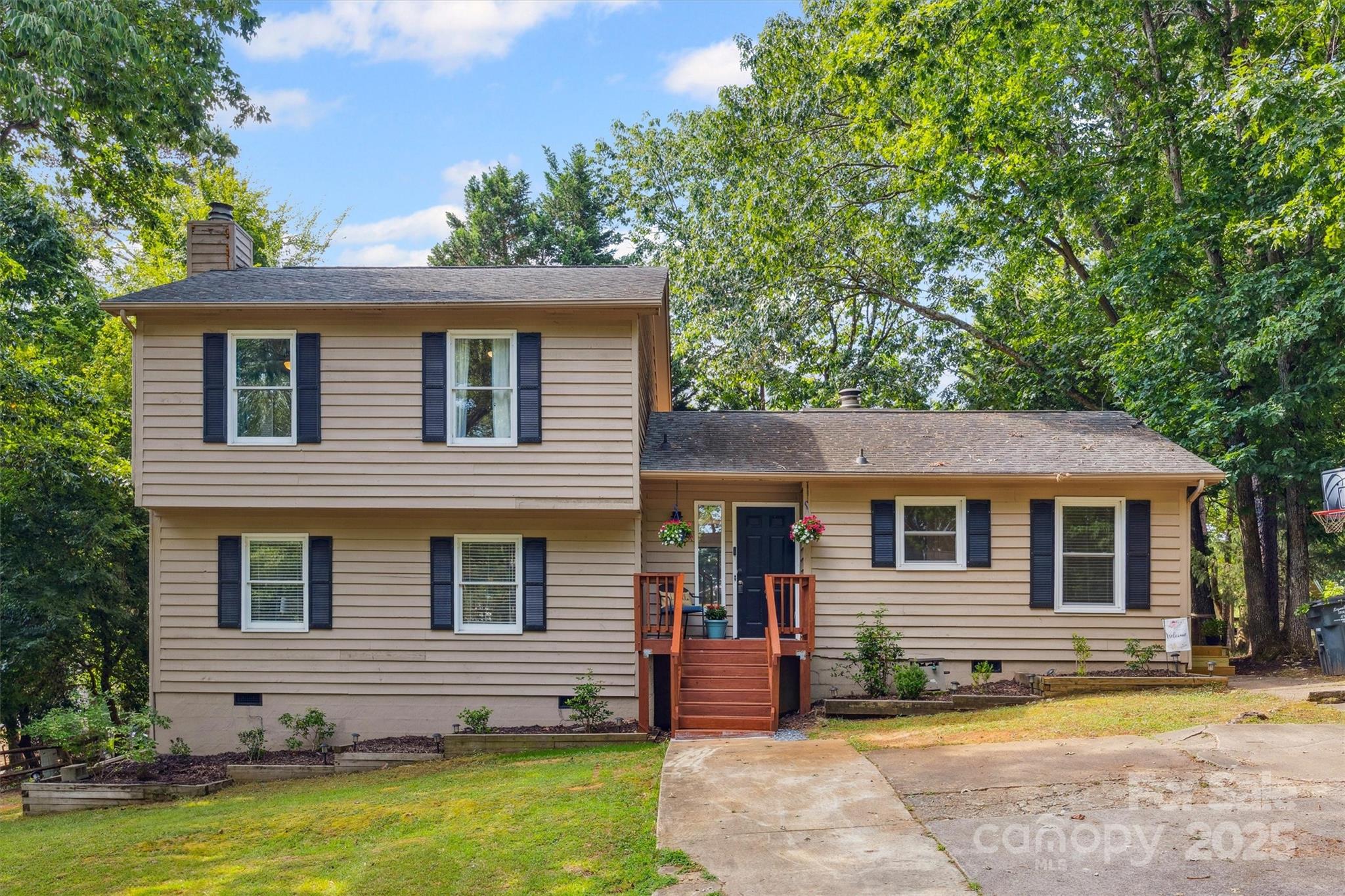 9111 Windjammer Drive Tega Cay, SC 29708 - Photo 1 of 36 a view of a house with a swimming pool