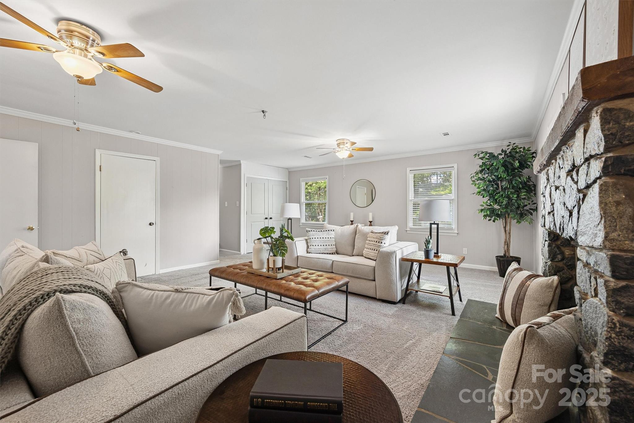 9111 Windjammer Drive Tega Cay, SC 29708 - Photo 21 of 36 a living room with furniture and a fireplace