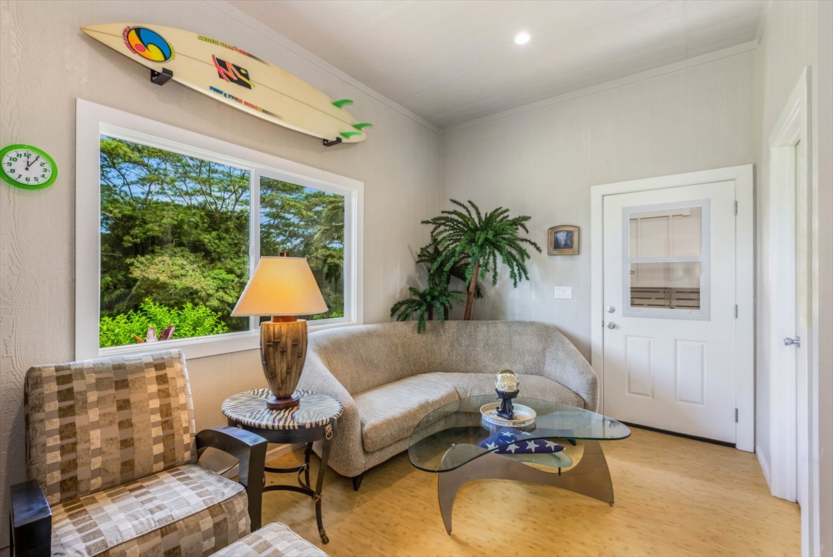 4321 Kapuna Road, Unit D Kilauea, HI 96754 - Photo 23 of 23 a living room with furniture and a large window