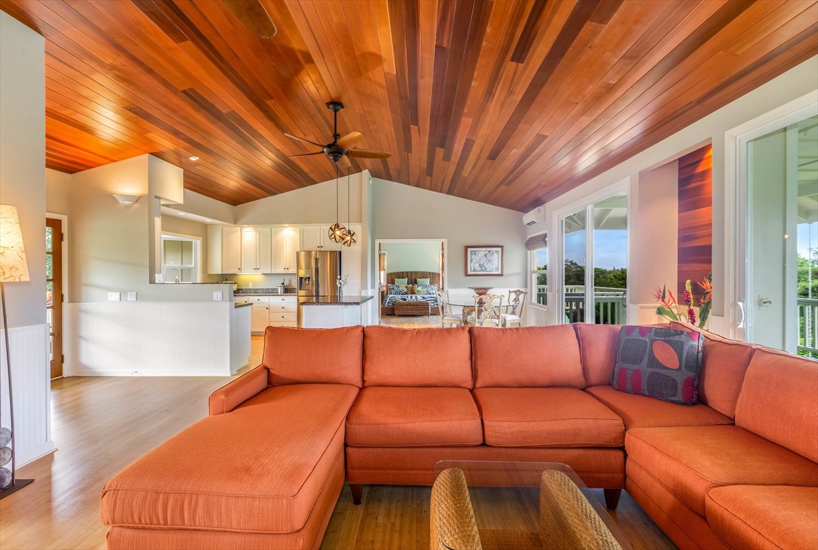 4321 Kapuna Road, Unit D Kilauea, HI 96754 - Photo 5 of 23 a living room with furniture and a large window