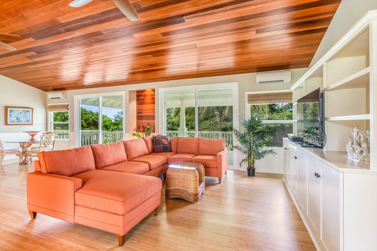 4321 Kapuna Road, Unit D Kilauea, HI 96754 - Photo 7 of 23 a living room with furniture with large windows