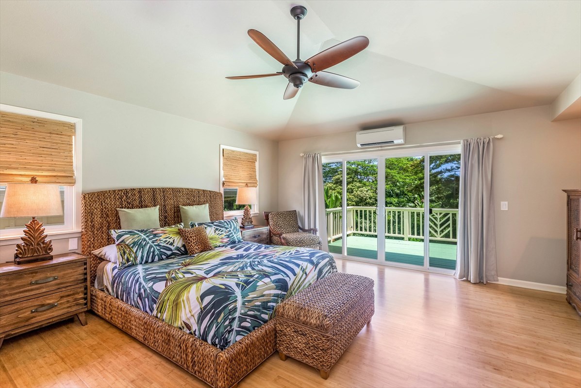 4321 Kapuna Road, Unit D Kilauea, HI 96754 - Photo 10 of 23 a spacious bedroom with a bed and a large window
