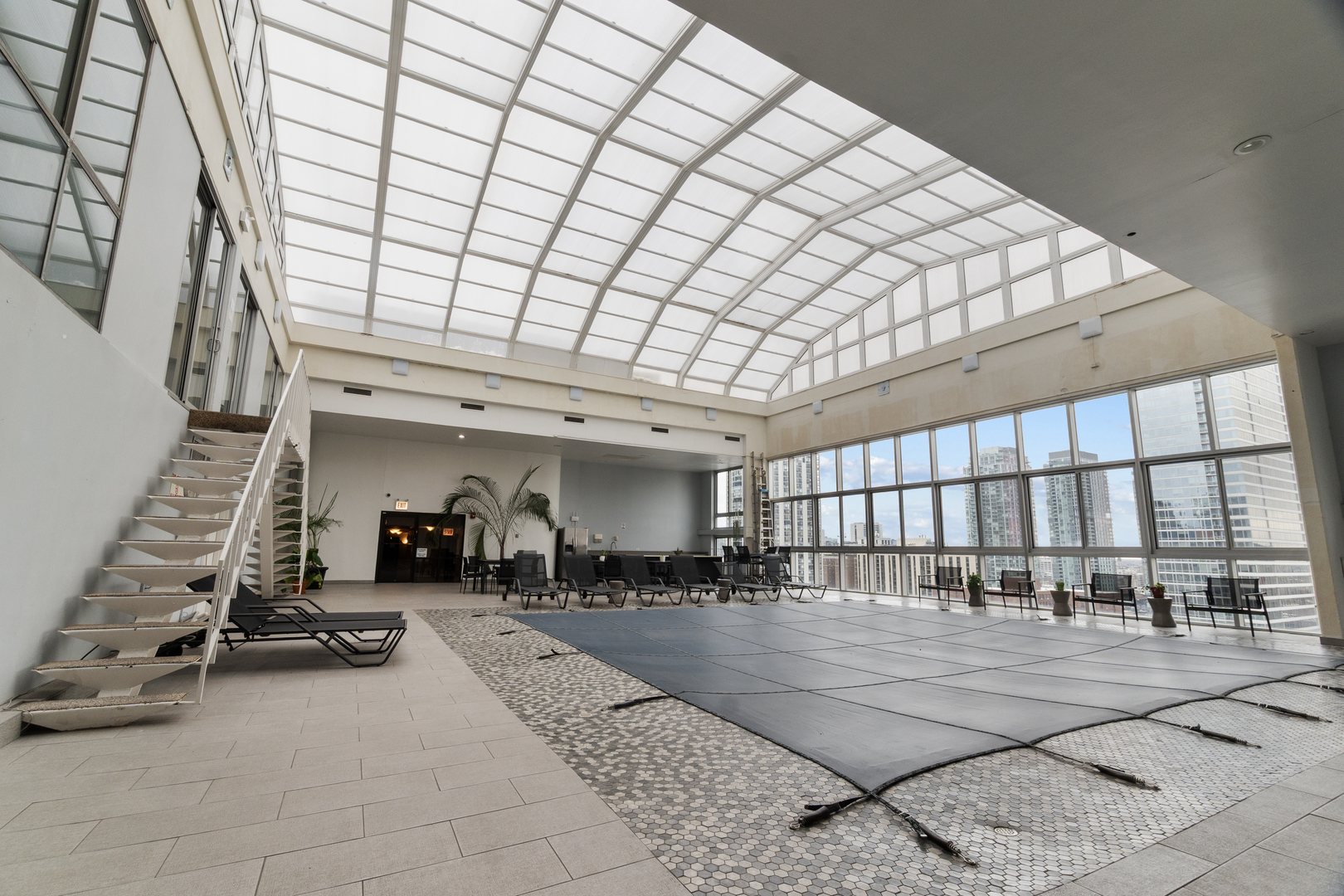 1221 North Dearborn Street, Unit PH8S Chicago, IL 60610 - Photo 22 of 24 a room with lots of gym equipment