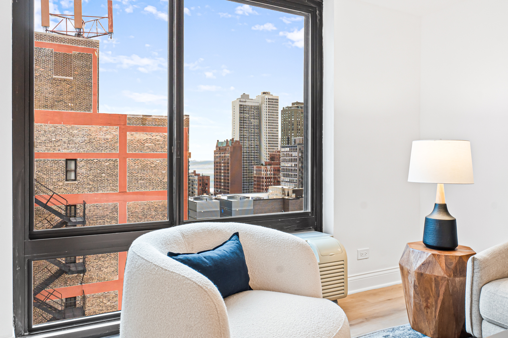 1221 North Dearborn Street, Unit PH8S Chicago, IL 60610 - Photo 8 of 24 a living room with furniture and a large window