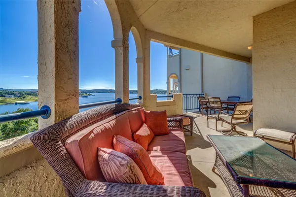 a outdoor living space with furniture and city view