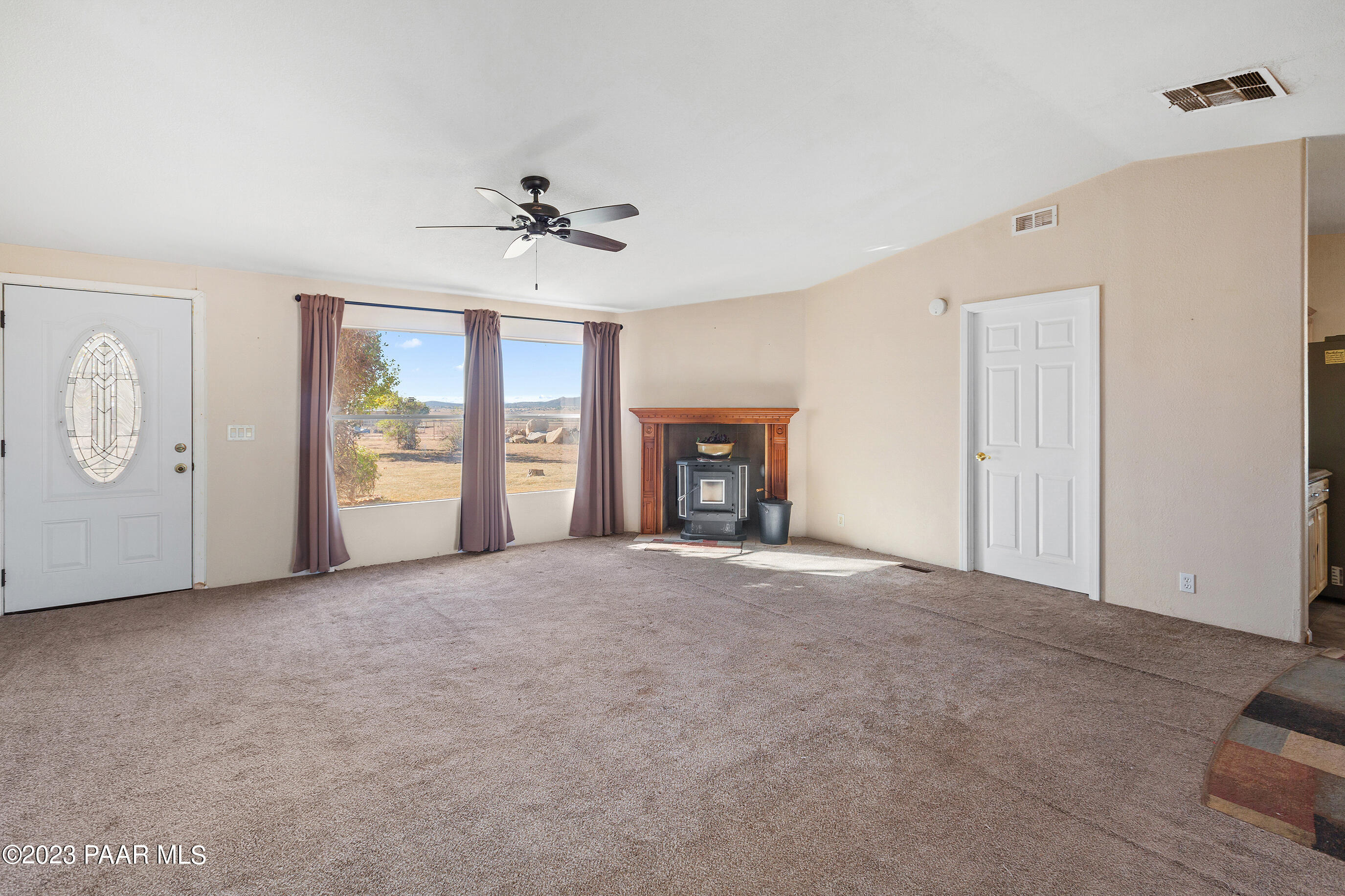 1240 Saddle Road Paulden, AZ 86334 - Photo 15 of 40 an empty room with windows and cabinet