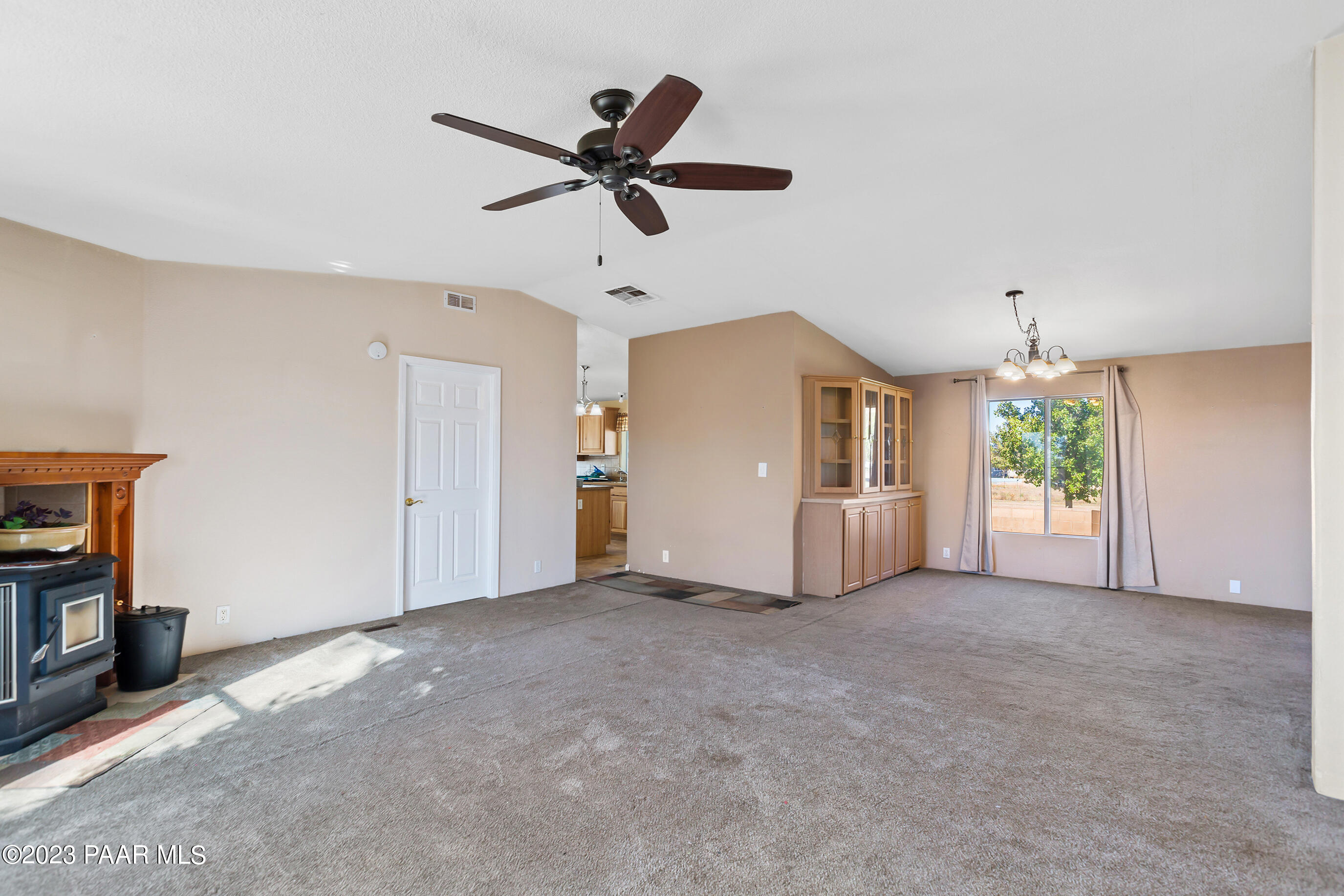 1240 Saddle Road Paulden, AZ 86334 - Photo 17 of 40 a view of a livingroom with an empty space and a fireplace