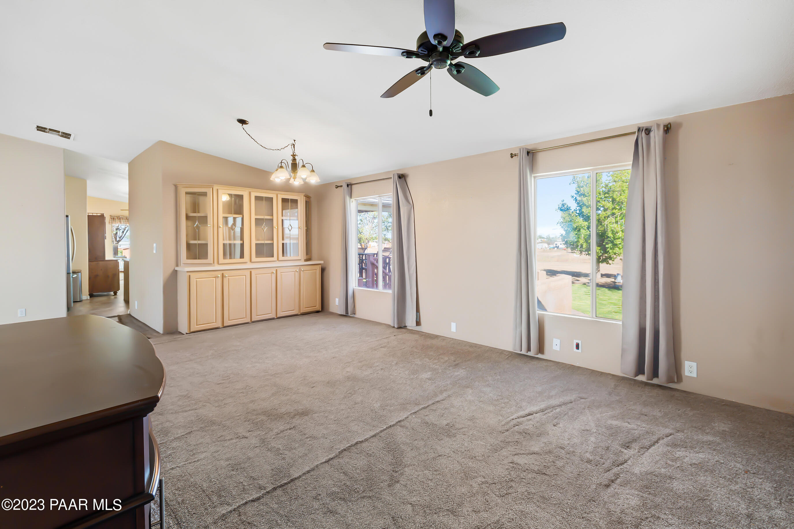 1240 Saddle Road Paulden, AZ 86334 - Photo 19 of 40 a view of a big room with windows and cabinet