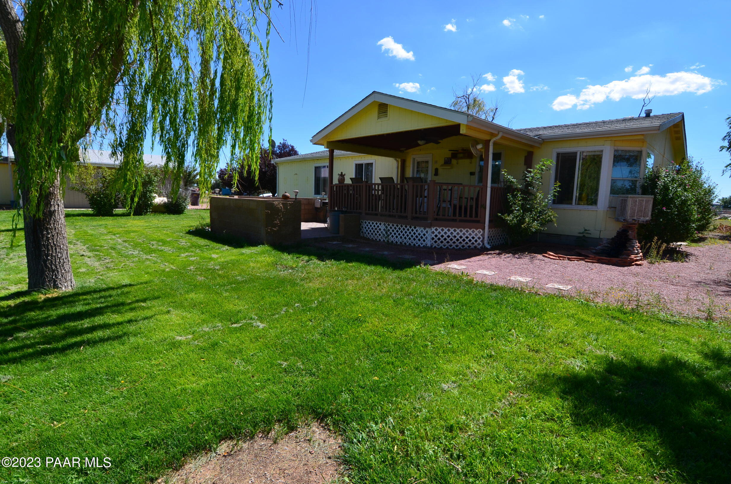 1240 Saddle Road Paulden, AZ 86334 - Photo 2 of 40 a view of a house with a yard porch and sitting area