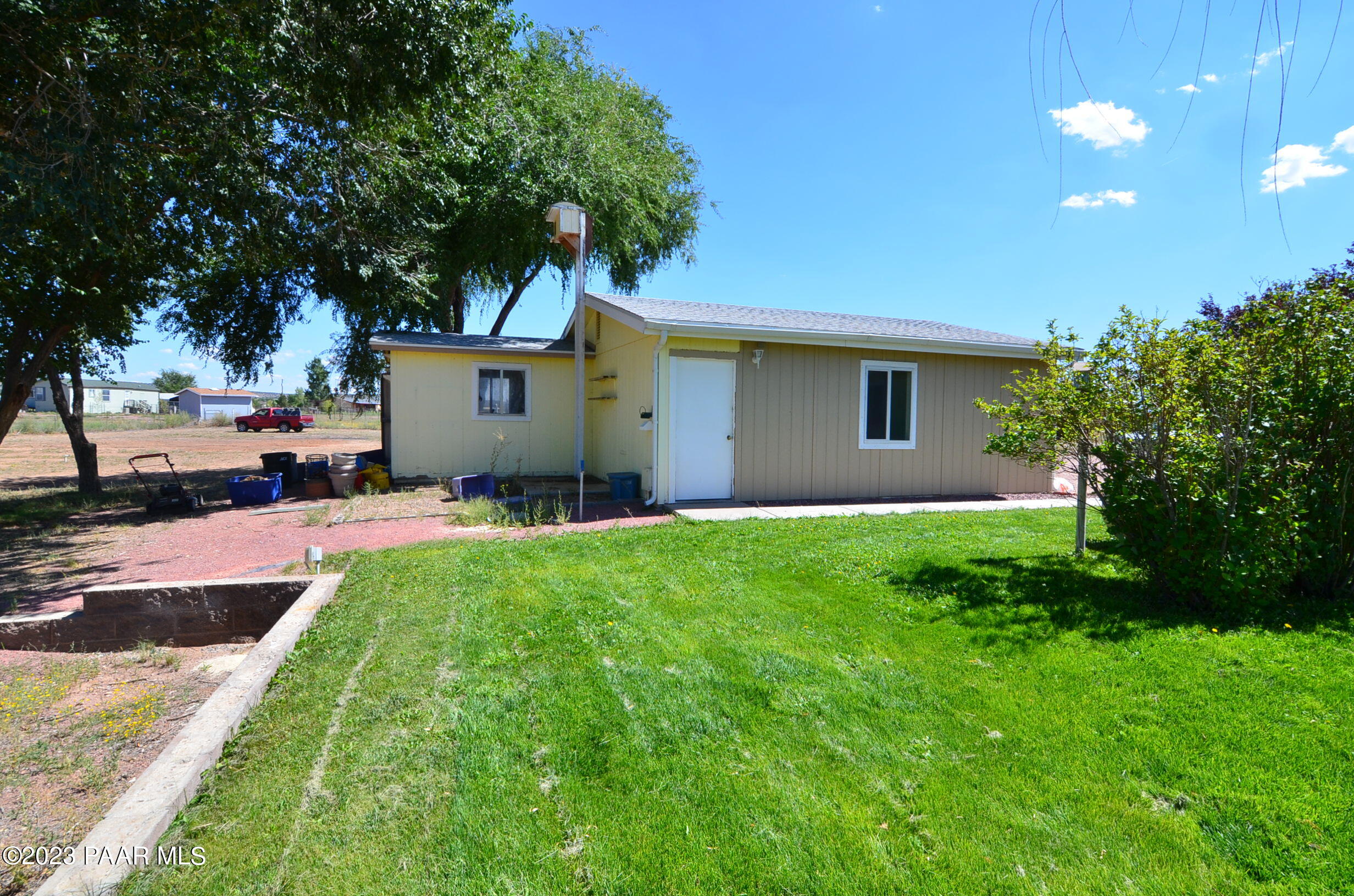 1240 Saddle Road Paulden, AZ 86334 - Photo 21 of 40 a view of a backyard with a garden and plants