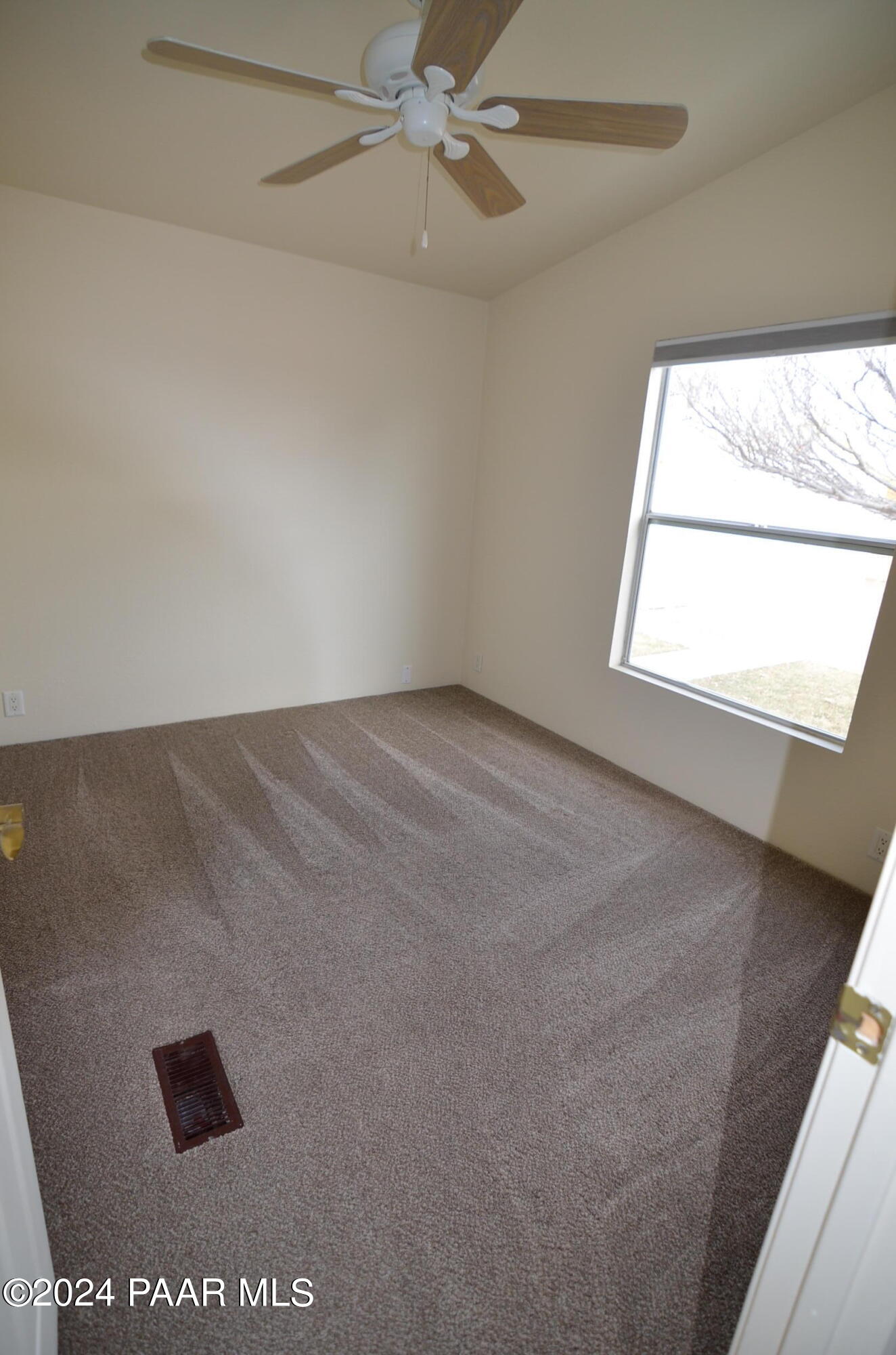 1240 Saddle Road Paulden, AZ 86334 - Photo 31 of 40 an empty room with a window