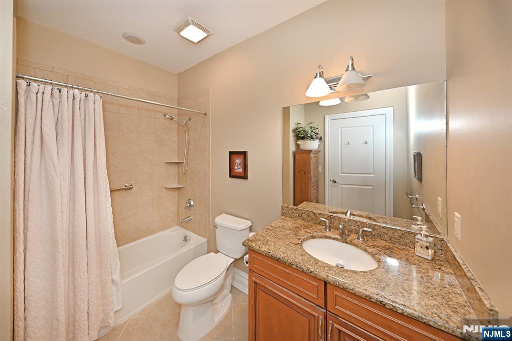 2303 Rio Vista Lane Northvale, NJ 07647 - Photo 14 of 30 a bathroom with a sink toilet double vanity and shower