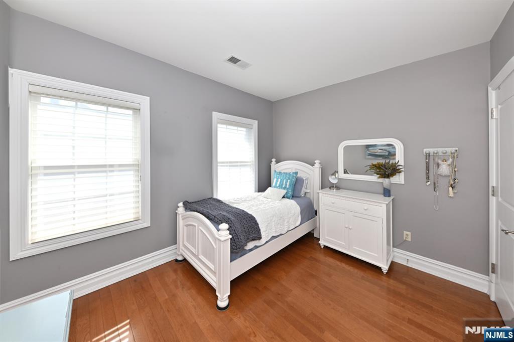 2303 Rio Vista Lane Northvale, NJ 07647 - Photo 15 of 30 a bedroom with a bed and wooden floor