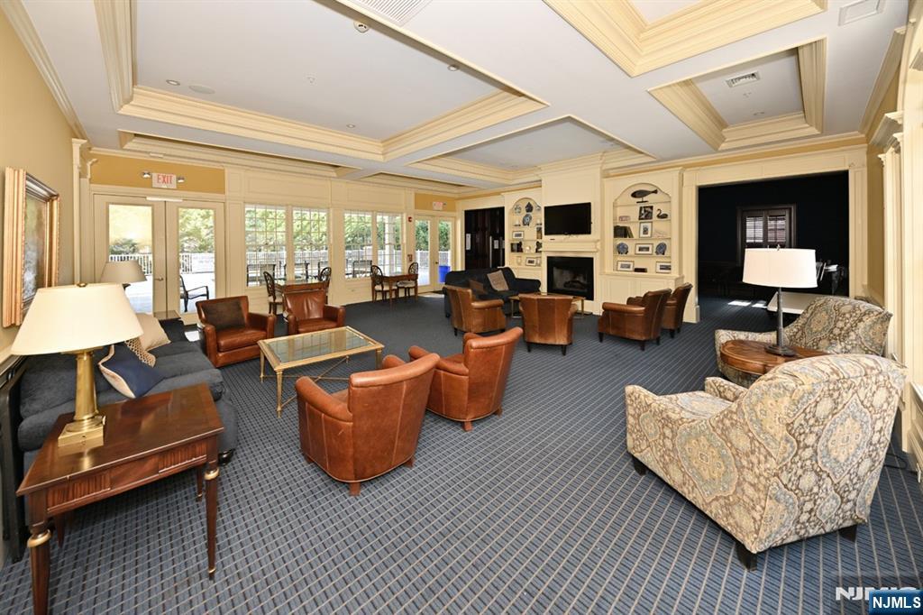 2303 Rio Vista Lane Northvale, NJ 07647 - Photo 24 of 30 a living room with furniture fireplace and a large window