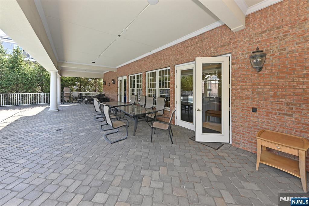 2303 Rio Vista Lane Northvale, NJ 07647 - Photo 29 of 30 a view of a patio with table and chairs and wooden fence